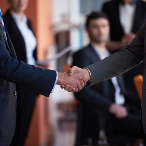 two men shaking hands - square Handing over to the new manager can free you up for new projects.