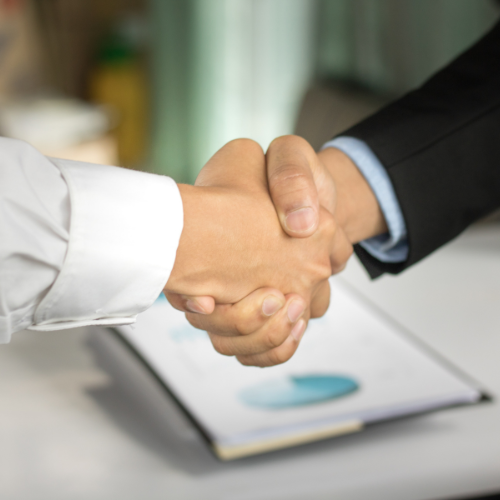 woman and man shaking hand in partnership in business - square When you dot your i's and cross your t's the road to a successful sale is so much easier.